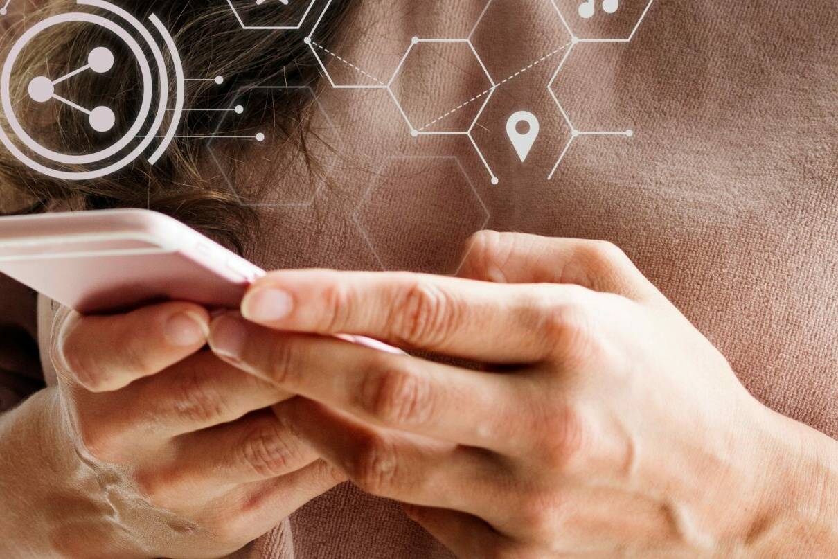 Smiling woman texting on her phone
